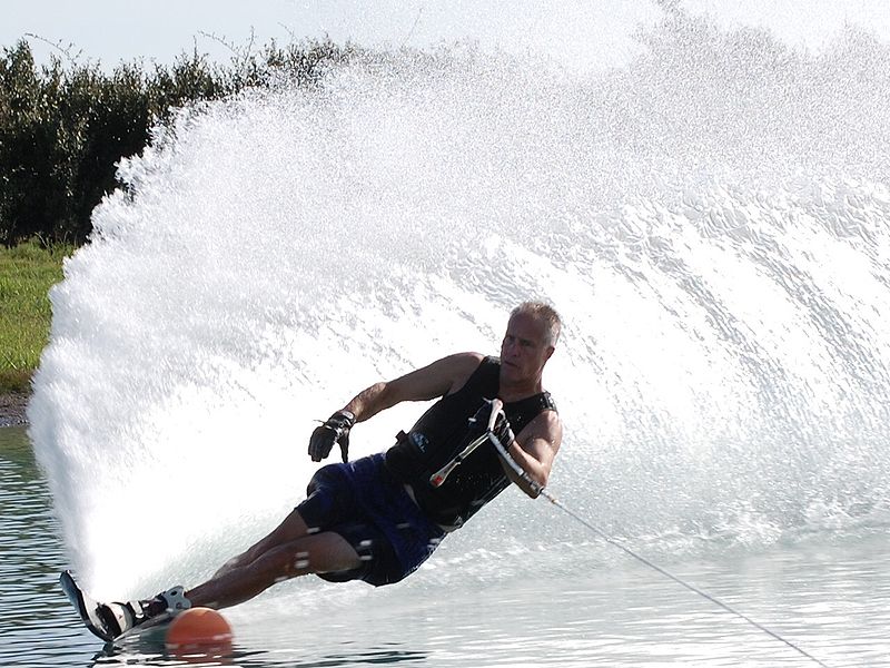 A water skier makes a huge wave